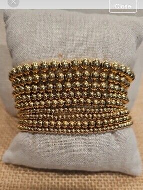 New PLUNDER 9 Strand Gold Bracelet